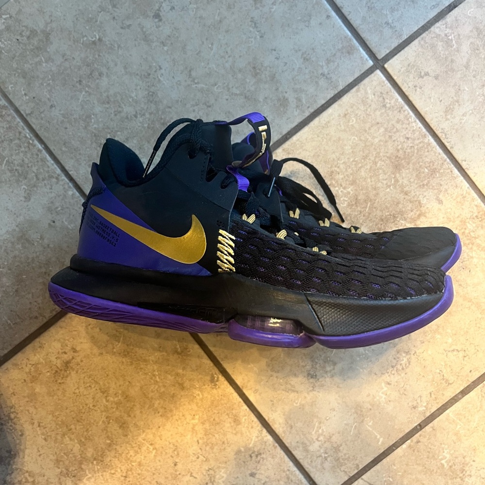 Nike Black and Purple Athletic Shoes with Gold Accents
